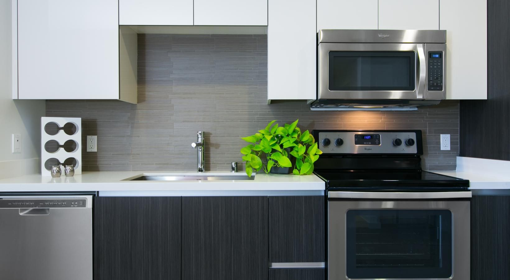 Spacious kitchens with thoughtful details a kitchen with white cabinets