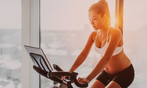 Best Gyms in San Jose Best Gyms in San Jose | Woman riding an exercise machine