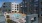 a swimming pool in a courtyard between buildings