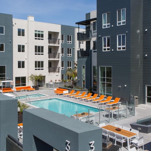 Resort-style swimming pool a group of buildings