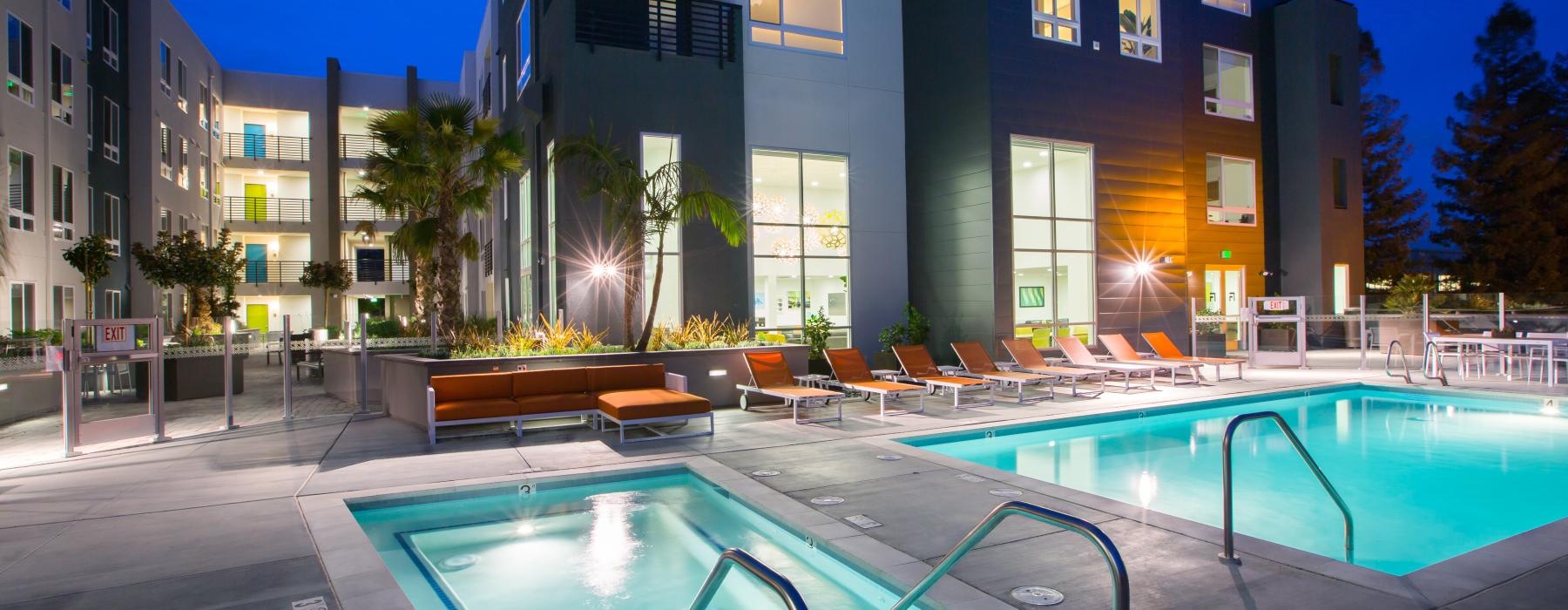 a swimming pool in front of a building