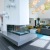 a large room with a large glass table and a couch