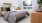 a bedroom with a bed and a plant