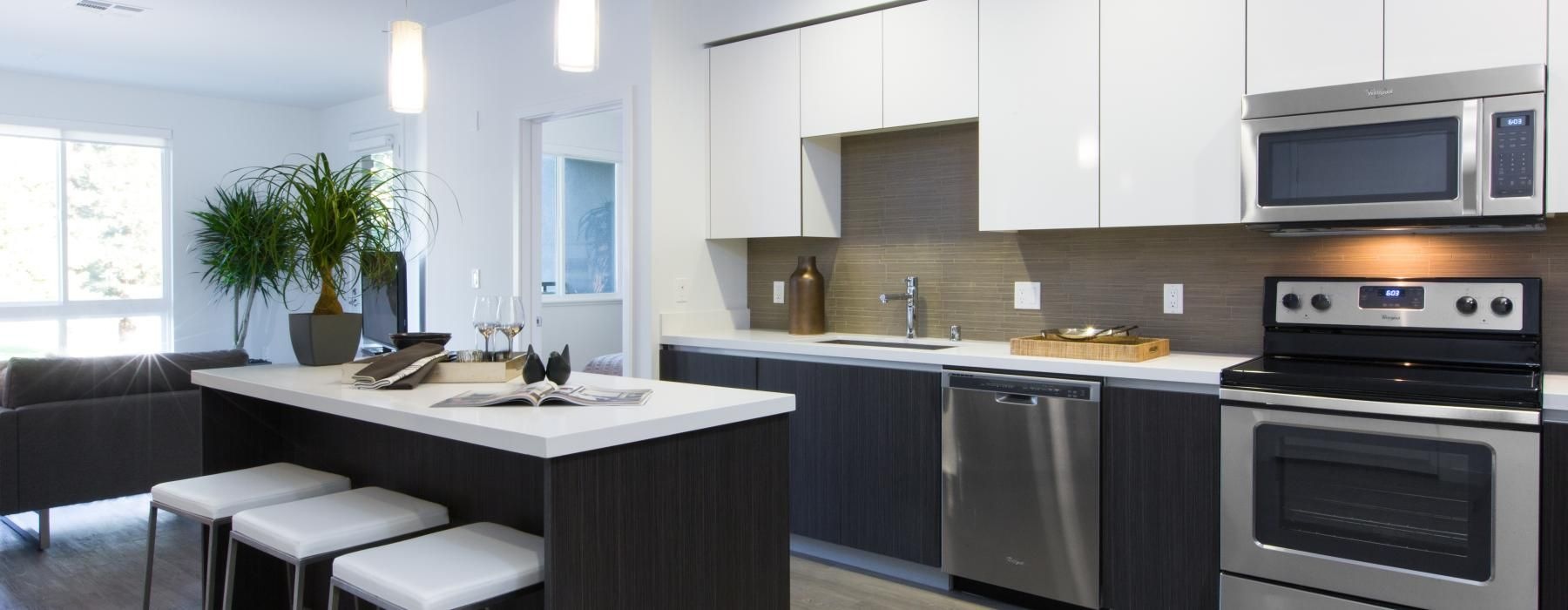 a kitchen with white cabinets
